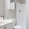 a bathroom with a shower and sink