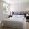 a bedroom with a bed and lamps