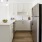 a kitchen with white cabinets