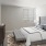 a bedroom with a bed and a bench